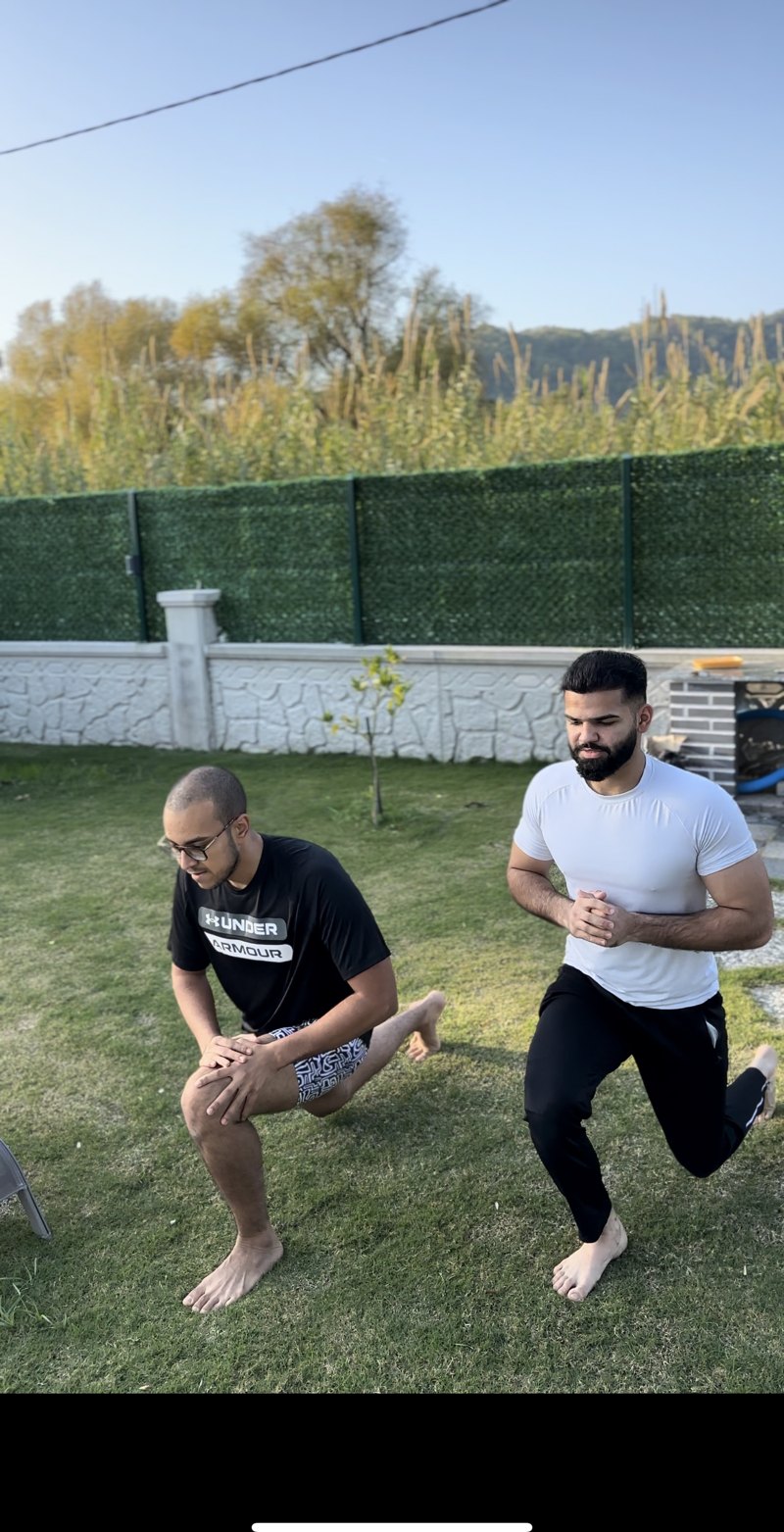 Hasnain coaching a client through training